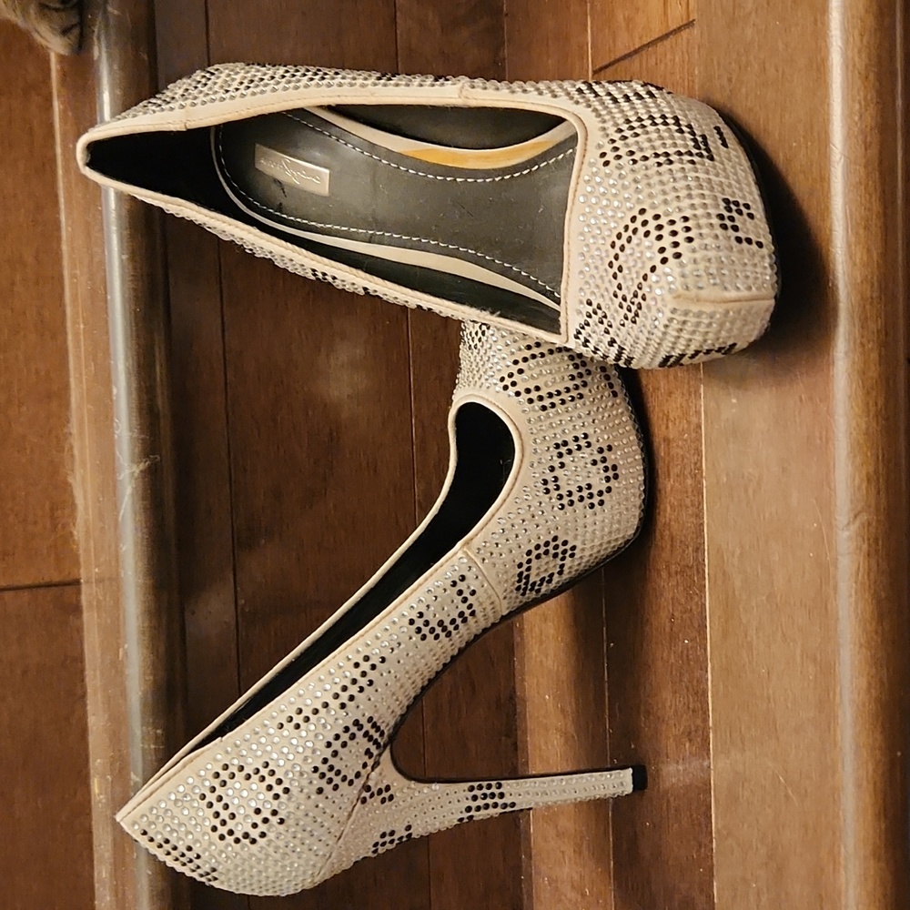 Black and white drain platform heels